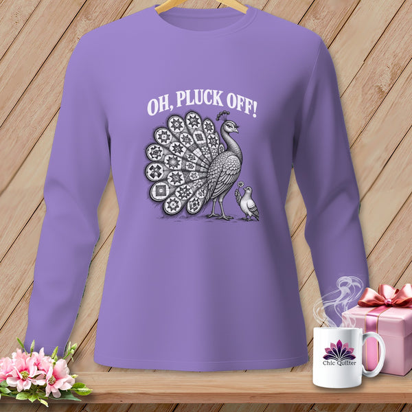 Purple long-sleeve t-shirt with a graphic of a peacock, a smaller bird, and the text "OH, PLUCK OFF!" displayed against a wooden background.