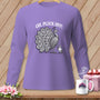 Purple long-sleeve t-shirt with a graphic of a peacock, a smaller bird, and the text "OH, PLUCK OFF!" displayed against a wooden background.