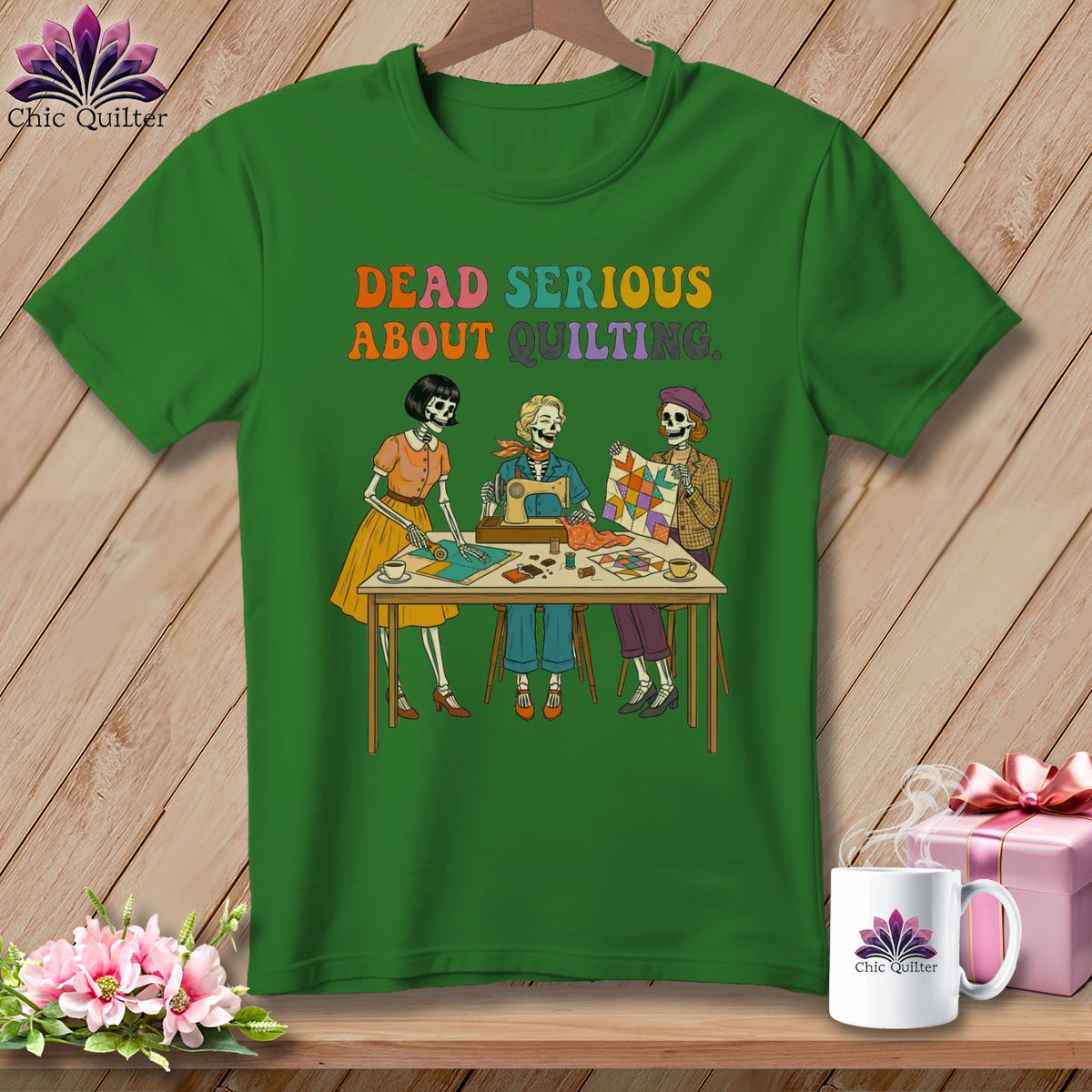 Green t-shirt with skeletons quilting and sewing, text "DEAD SERIOUS ABOUT QUILTING."