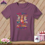 Plum crewneck t-shirt featuring a graphic of three colorful birds wearing glasses and flower crowns with the text Reading Glasses On Seam Ripper Armed.