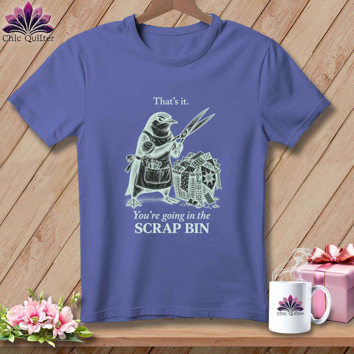 T-shirt with bird holding scissors over scrap bin; text reads "That's it. You're going in the SCRAP BIN."