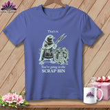 T-shirt with bird holding scissors over scrap bin; text reads 
