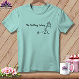 Light blue t-shirt with a stick figure and spool of thread, saying 