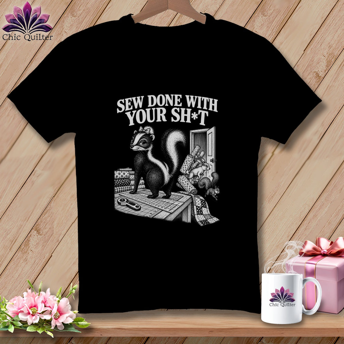 Black t-shirt with skunk sewing and text "Sew Done With Your Sh*t".