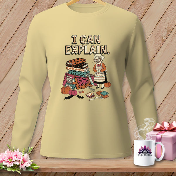 Light yellow long-sleeve shirt with illustration of a woman and Halloween fabric.