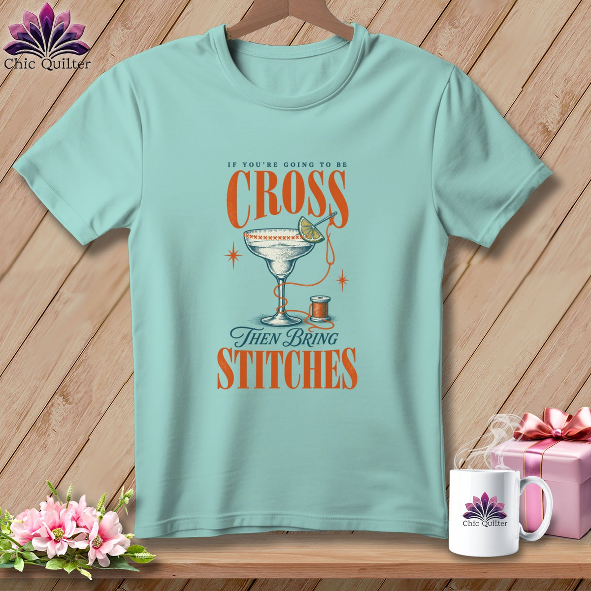 Light blue t-shirt with text "If you're going to be cross then bring stitches".
