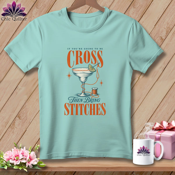 Light blue t-shirt with text "If you're going to be cross then bring stitches".