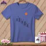 Purple t-shirt with a graphic of spools of thread and an orange button.