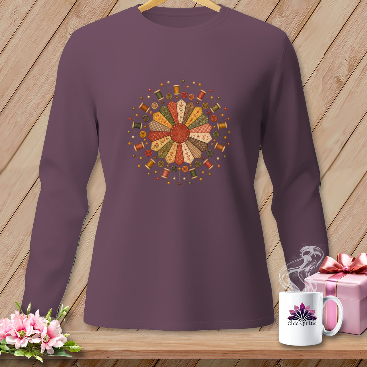 Long-sleeve plum sweatshirt with a circular quilt-inspired sewing motif and "Chic Quilter" mug.