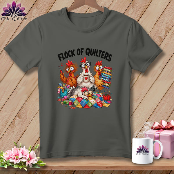 Dark gray t-shirt featuring a cartoon design of four chickens, with the text Flock of Quilters.