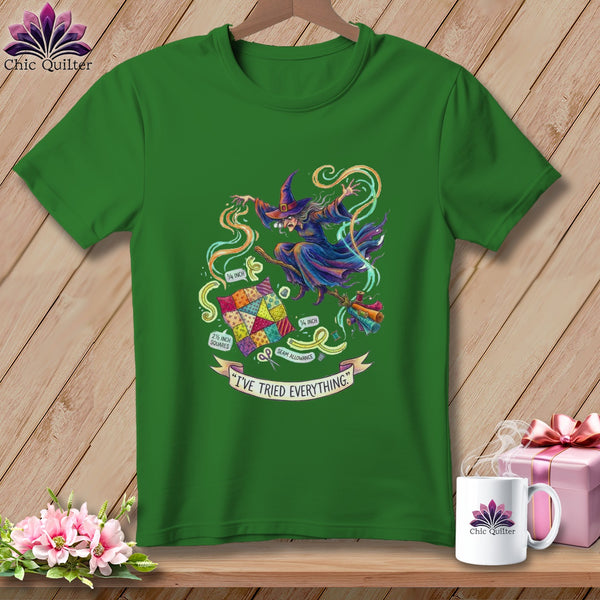 Green t-shirt with a witch flying a broomstick, surrounded by quilting items and text.