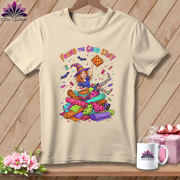 Witch surrounded by colorful fabric rolls with text "Found The Good Stuff".