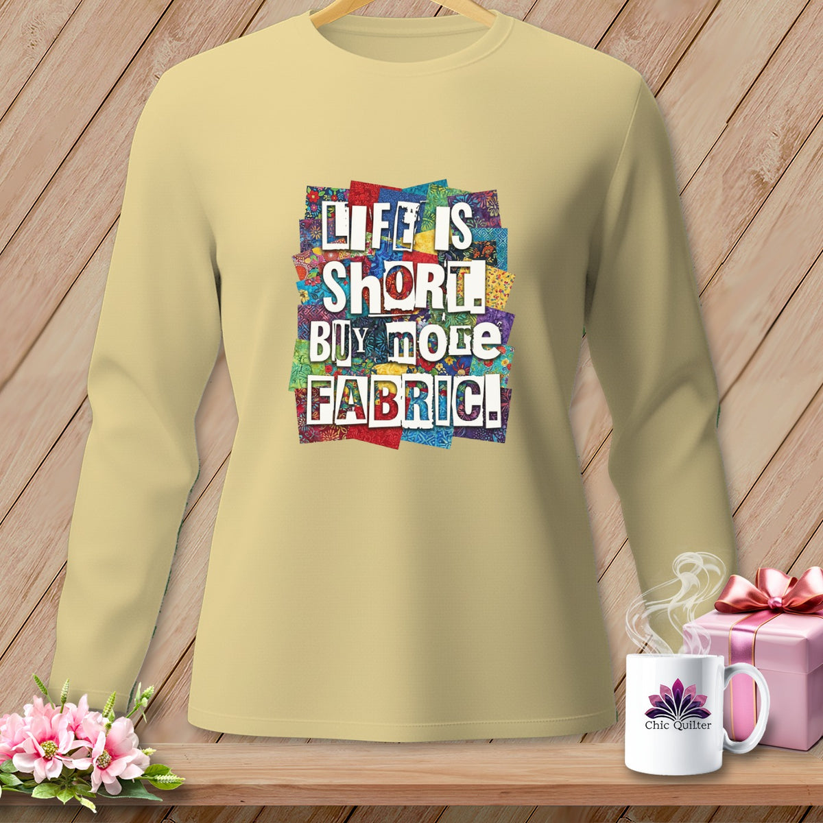 Light yellow long sleeve shirt with "LIFE IS SHORT. BUY MORE FABRIC!" text graphic.
