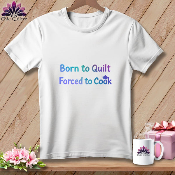 White t-shirt with "Born to Quilt Forced to Cook" text and a cooking pot icon.