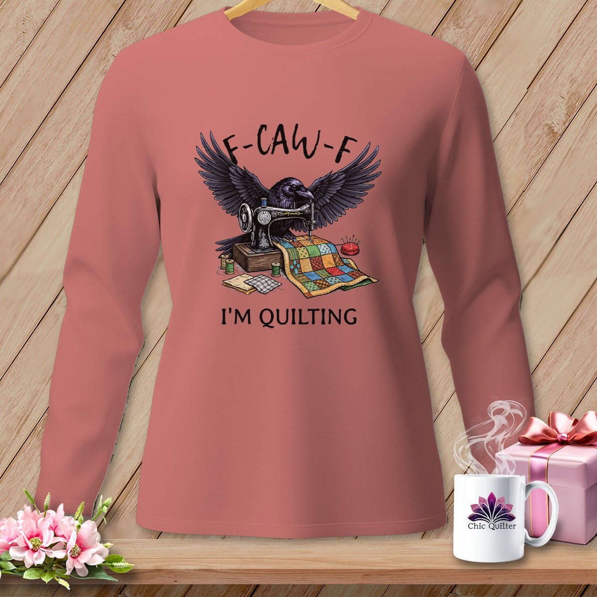 Raven at sewing machine with quilt and text "F-CAW-F I'M QUILTING."