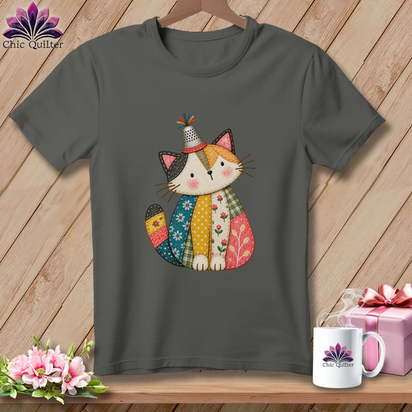 A dark gray t-shirt with a cartoon cat wearing a thimble hat, printed on the chest.