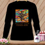 Black long-sleeve shirt with a graphic of a witch riding a ruler, text "FABRIC RUN".