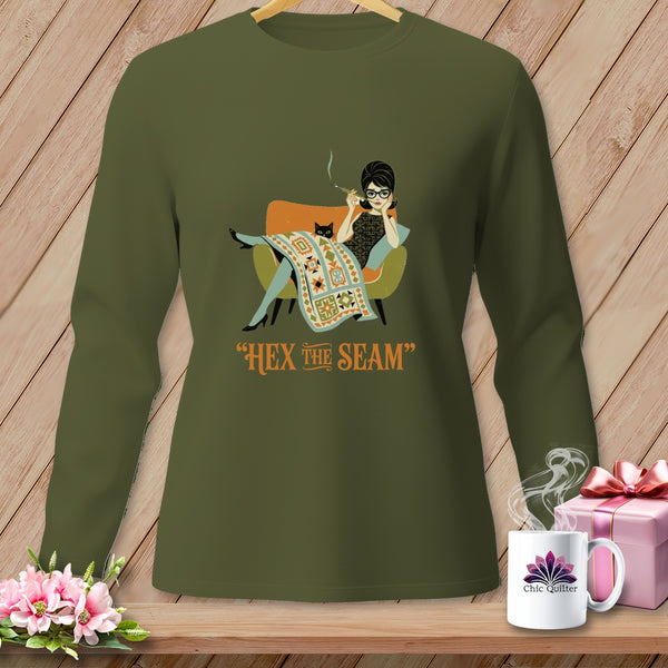 Green long-sleeve shirt with graphic of woman and cat, saying "Hex the Seam".