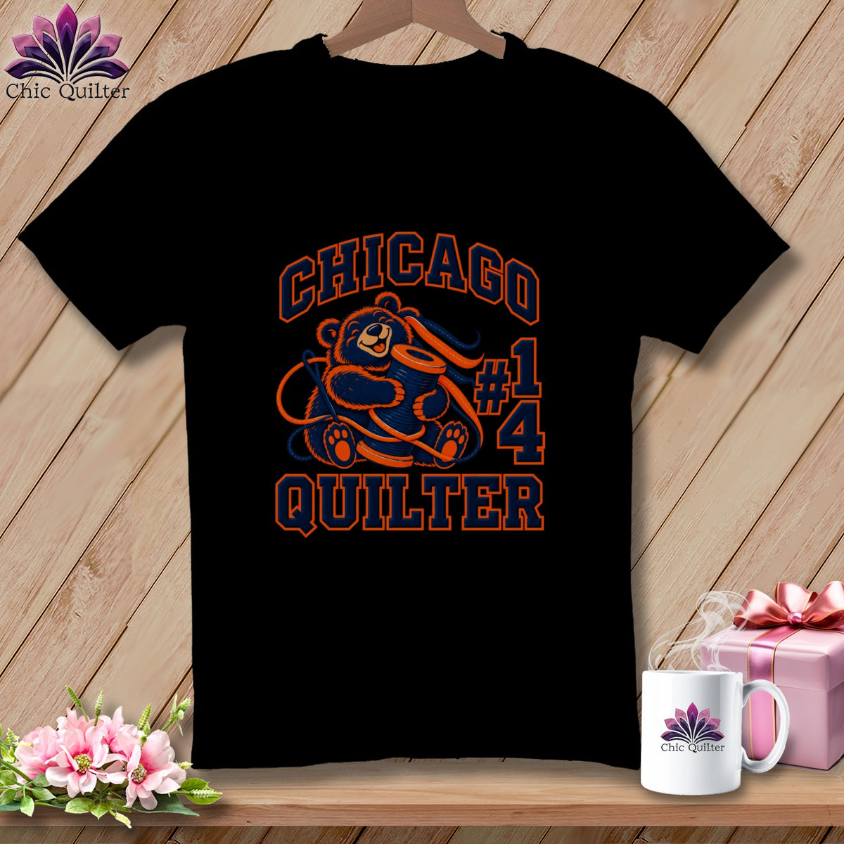 A black t-shirt features a graphic of a bear holding a spool of thread, surrounded by the text Chicago Quilter #14.