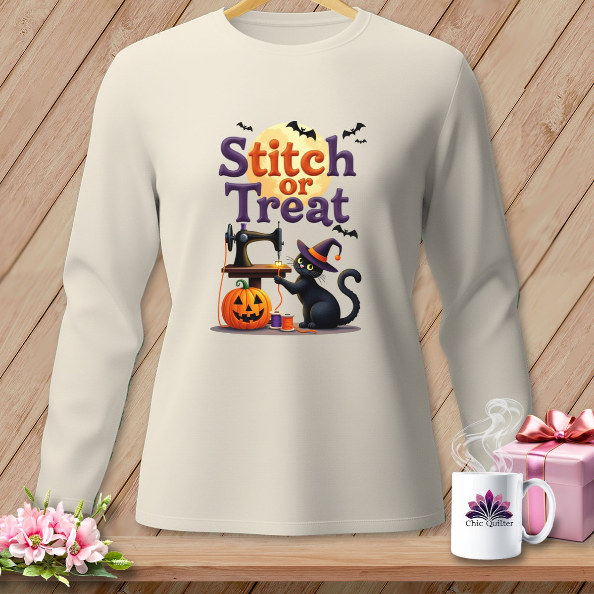 Cream long sleeve shirt with "Stitch or Treat" Halloween graphic featuring a black cat and sewing machine.