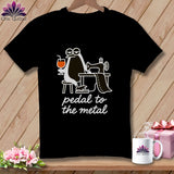 Black t-shirt with cartoon penguin at sewing machine, holding drink, text 