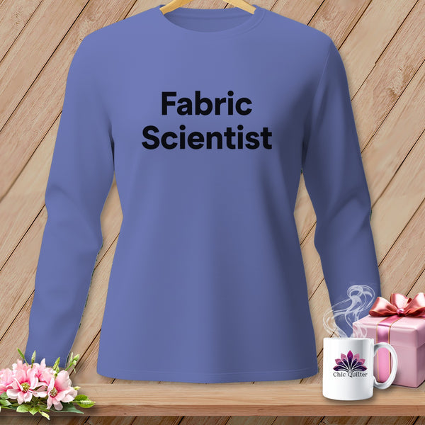 Purple long-sleeve shirt with "Fabric Scientist" text, next to a mug and gift.