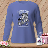 Long sleeve shirt with a raccoon holding a rotary cutter and text 