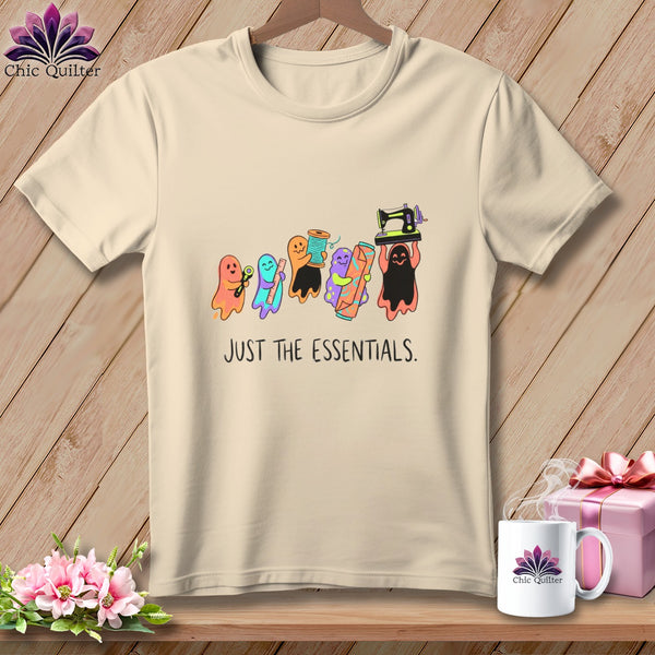 Cream t-shirt with cartoon ghosts holding sewing supplies and the text "JUST THE ESSENTIALS."