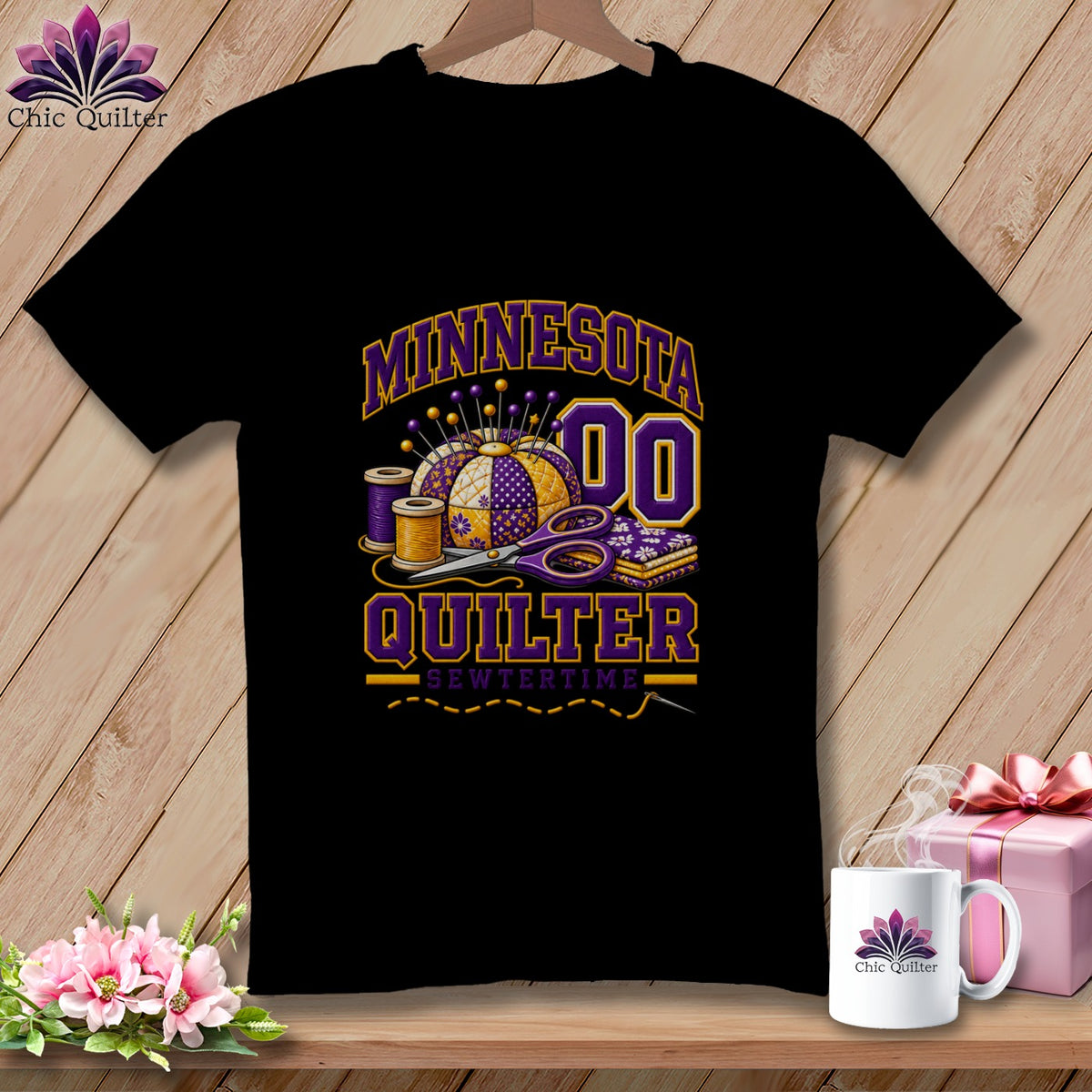 Black t-shirt featuring a purple and yellow graphic with a pincushion, scissors, and text reading Minnesota Quilter.