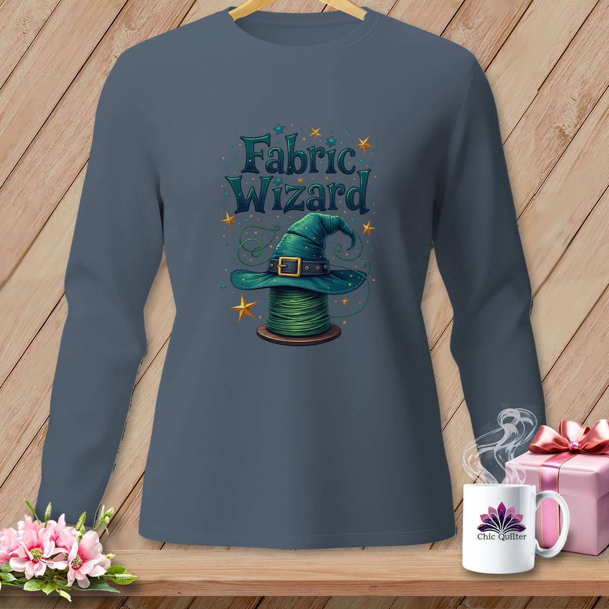 Long-sleeve t-shirt with a "Fabric Wizard" graphic of a witch hat on a spool of green thread.