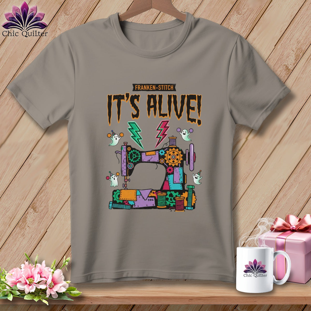 Franken-stitch "It's Alive!" graphic with sewing machine and ghosts on a t-shirt.