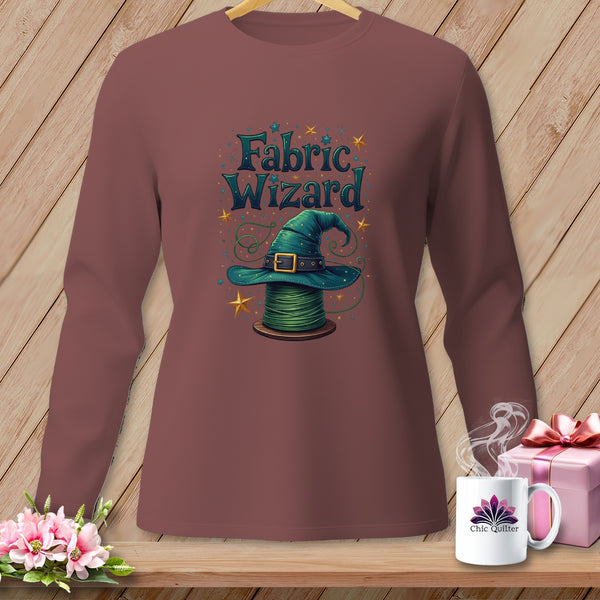 Long-sleeve shirt with a witch hat on a spool of green thread design.
