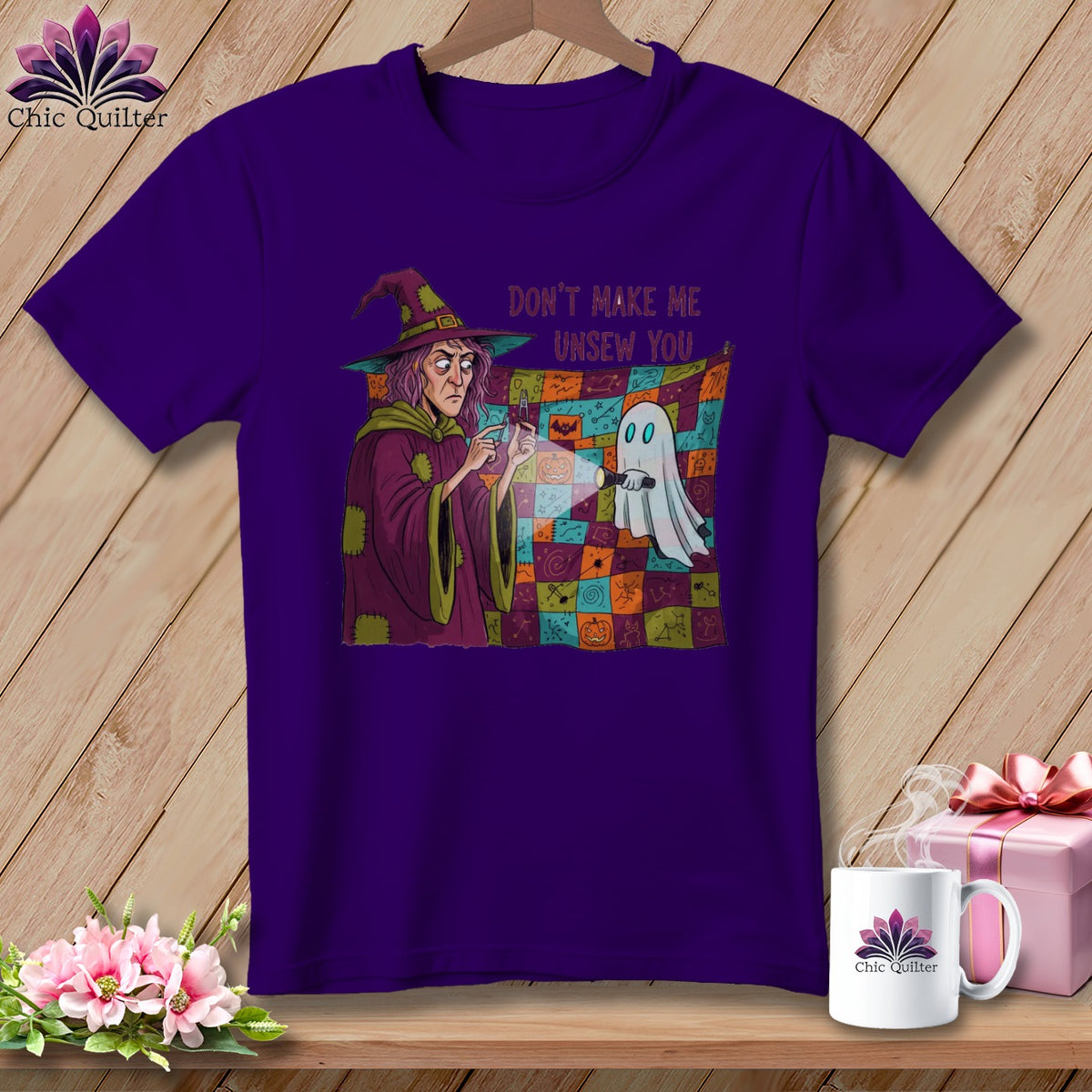 Purple t-shirt with a witch and ghost graphic and text "DON'T MAKE ME UNSEW YOU".