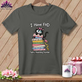 Dark gray t-shirt with a graphic of a black cat on a stack of fabrics and text reading I Have FHD Fabric Hoarding Disorder.