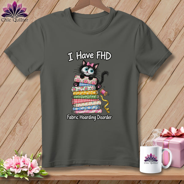 Dark gray t-shirt with a graphic of a black cat on a stack of fabrics and text reading I Have FHD Fabric Hoarding Disorder.