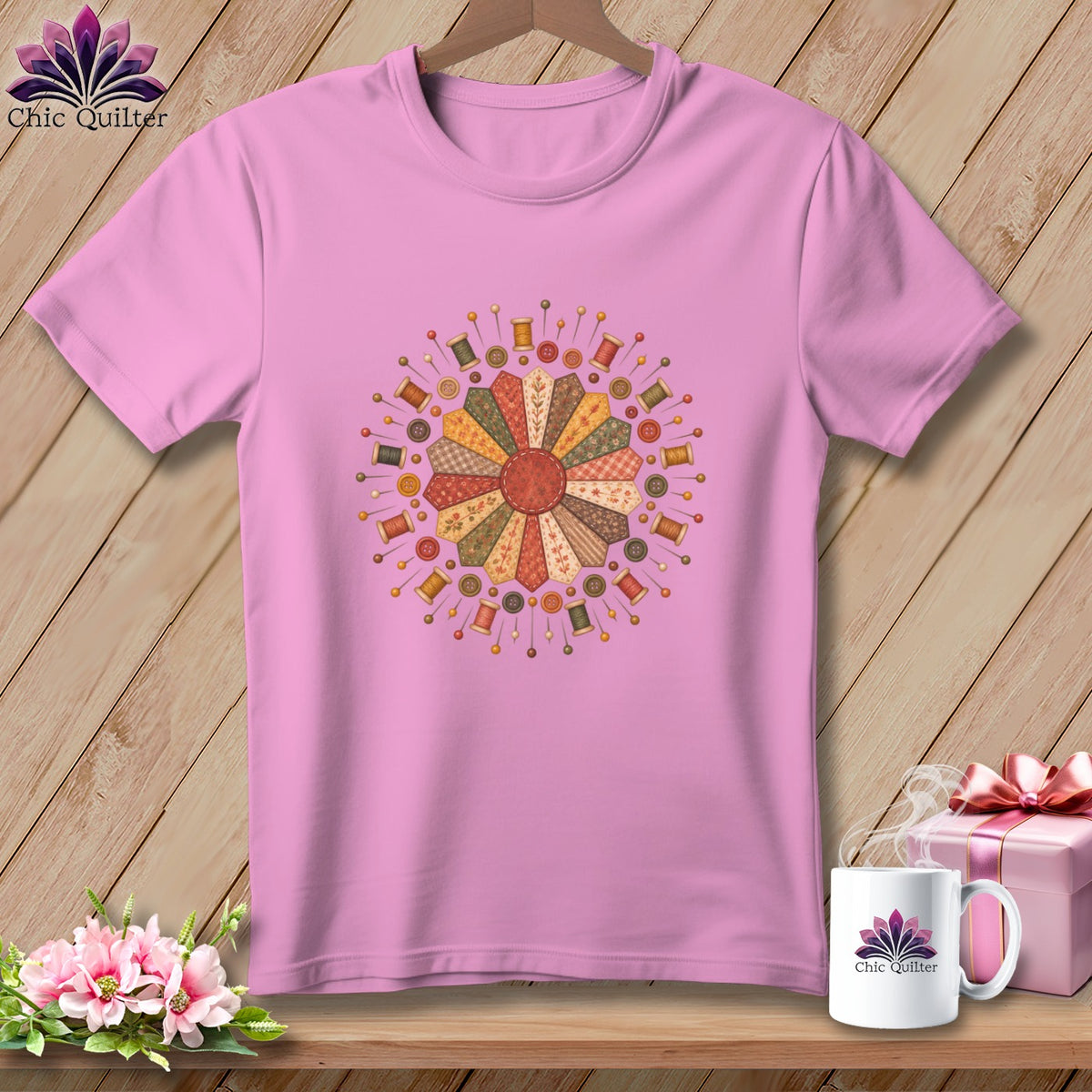Pink t-shirt with a patchwork flower design featuring sewing notions.