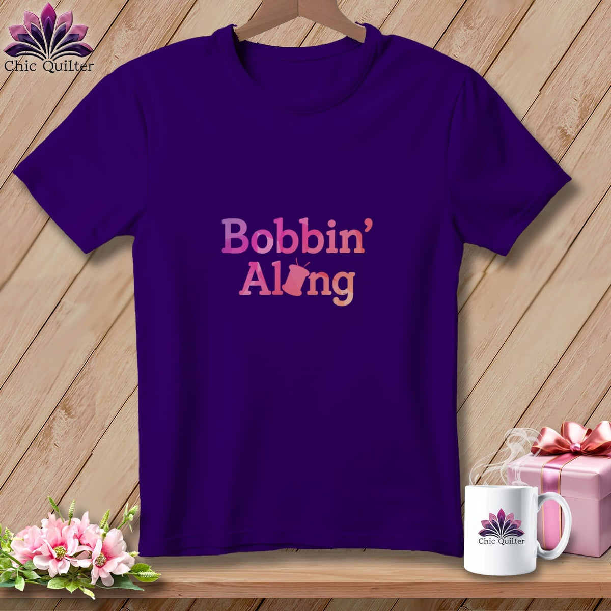 Purple t-shirt with "Bobbin' Along" text and sewing machine graphic.