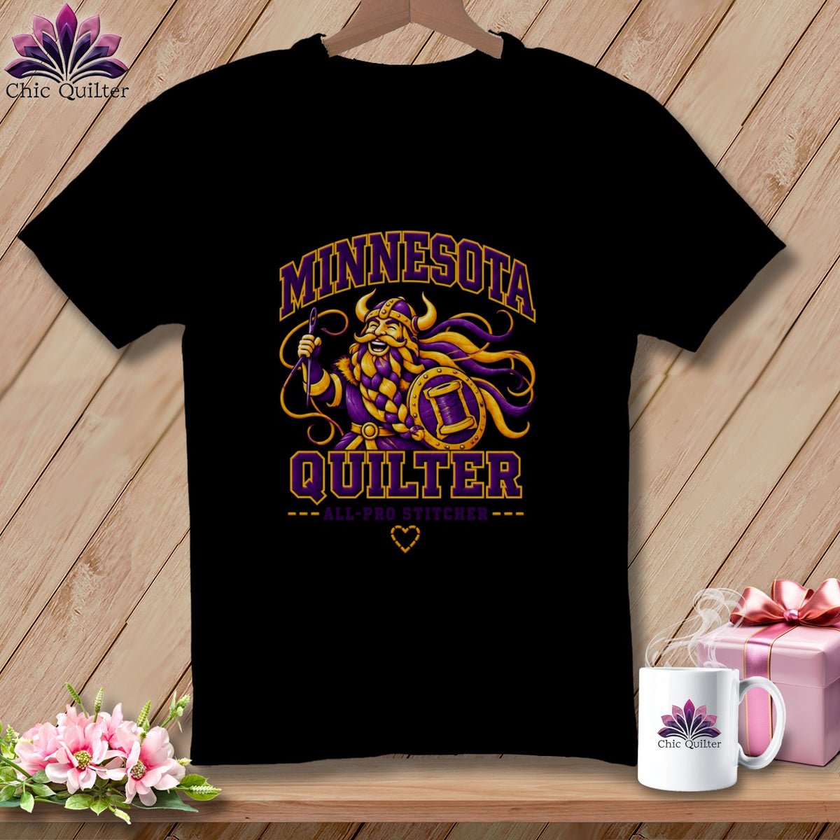 Black t-shirt featuring a Viking graphic with "Minnesota Quilter" text and a matching mug on a wooden background.
