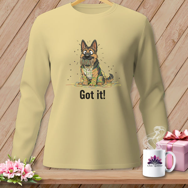 Light yellow long sleeve shirt with cartoon German Shepherd tangled in colorful yarn and text "Got it!".