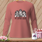 T-shirt graphic of three women peeking over a quilt with 