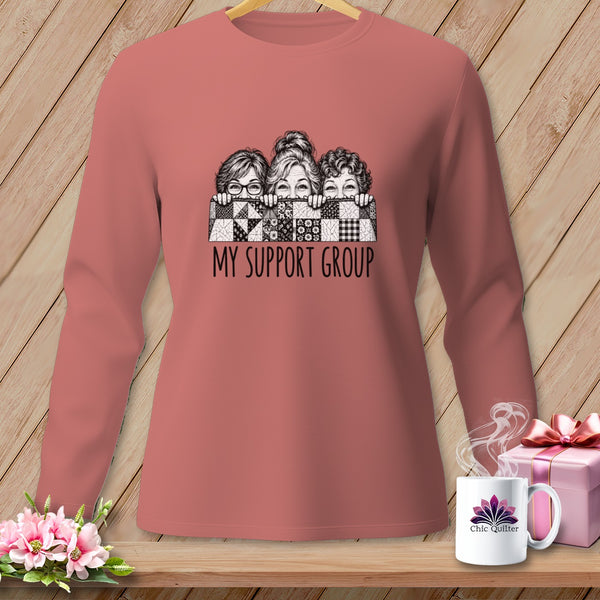 T-shirt graphic of three women peeking over a quilt with "My Support Group" text.