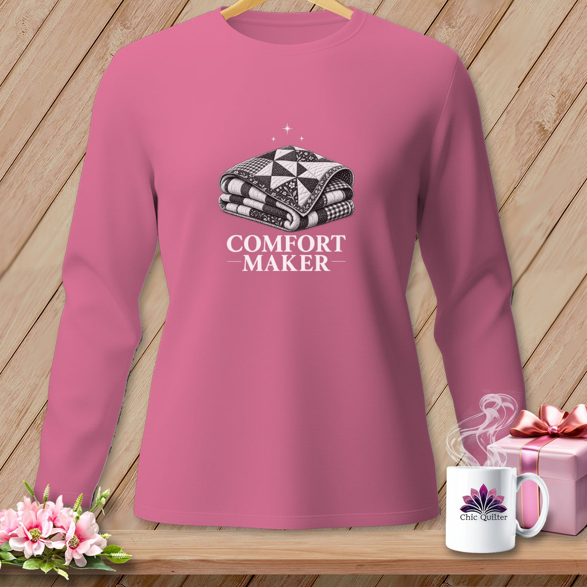 Pink long-sleeve shirt with a folded quilt graphic and "COMFORT-MAKER" text.