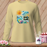 Light yellow long-sleeve shirt with a square graphic of a sewing machine and abstract colorful design.