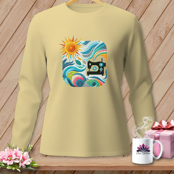 Light yellow long-sleeve shirt with a square graphic of a sewing machine and abstract colorful design.