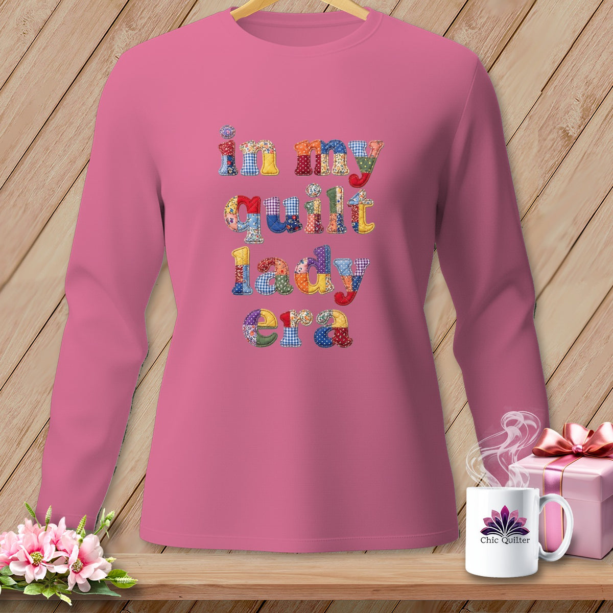 Pink long-sleeve shirt with colorful "in my quilt lady era" text.