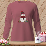 Long sleeve shirt with a stitched snowman wearing a hat and scarf, surrounded by spools of thread.