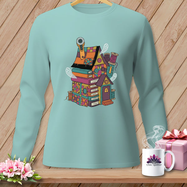 Mint long-sleeve shirt with a spooky quilting house graphic, mug, and gift.