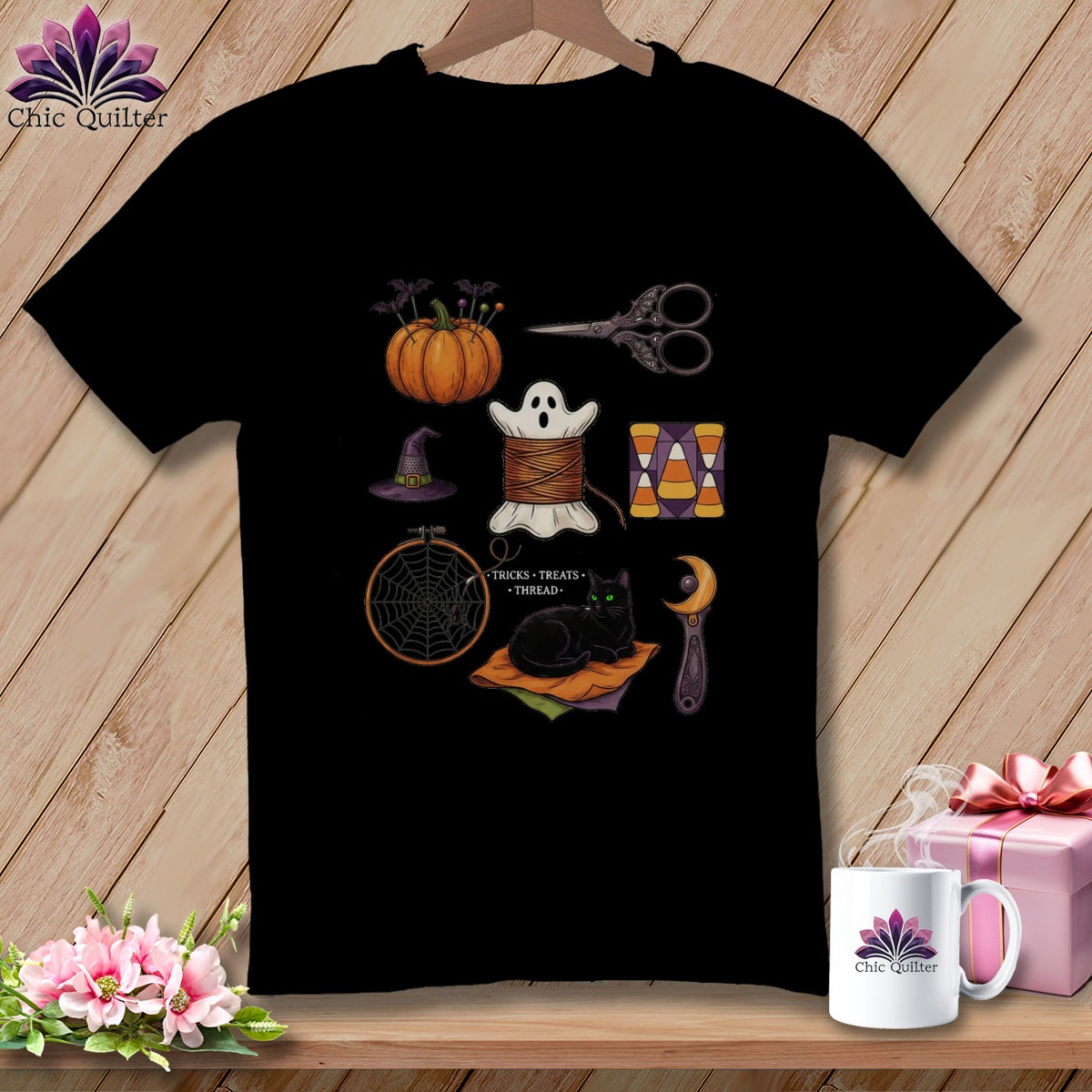 Black t-shirt with Halloween-themed sewing illustrations: pumpkin, ghost, cat, and candy corn.