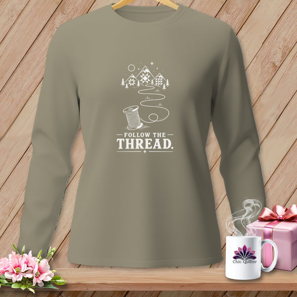 Long sleeve shirt with "Follow the Thread" graphic featuring a spool of thread and mountains.