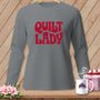 Gray long-sleeve shirt with red "Quilt Lady" text.
